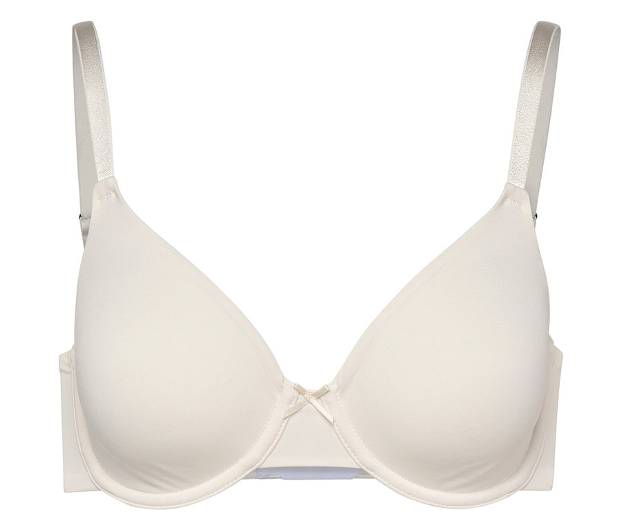 Kremowy biustonosz z fiszbinami i kokardką pośrodku.