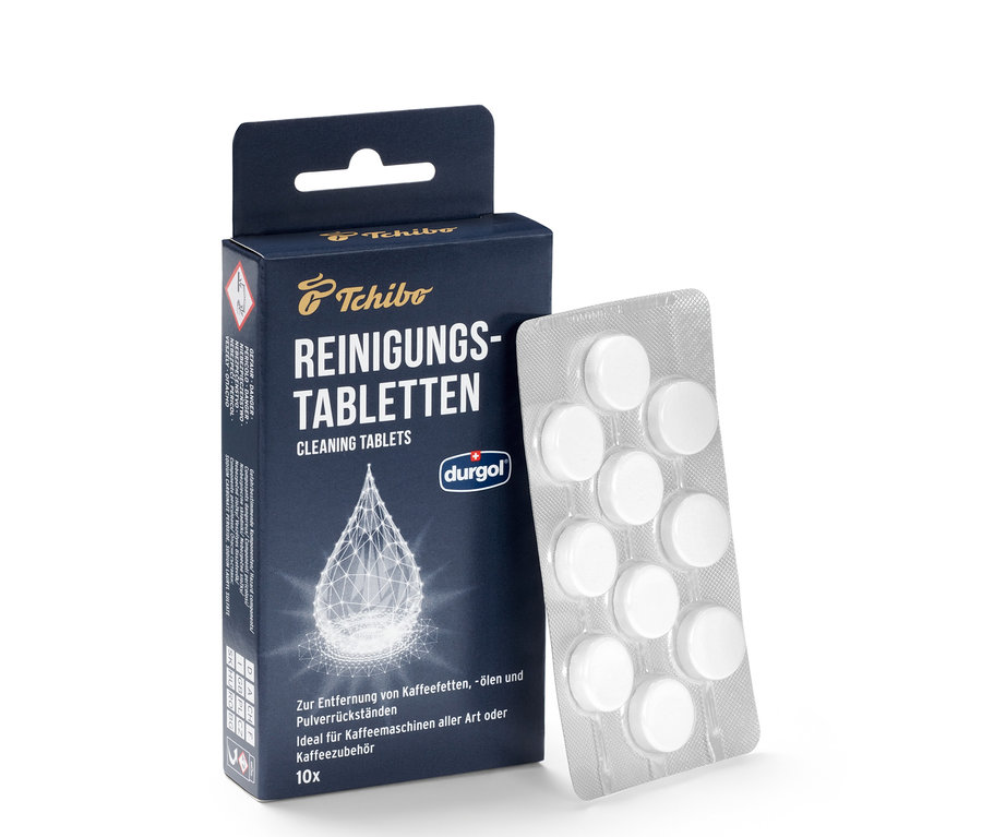 Opakowanie tabletek czyszczących durgol® do usuwania olejów kawowych oraz blister z tabletkami.