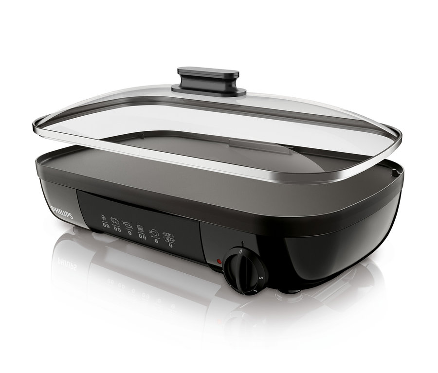 Czarny grill stołowy Philips HD6323/20 z przezroczystą szklaną pokrywą.