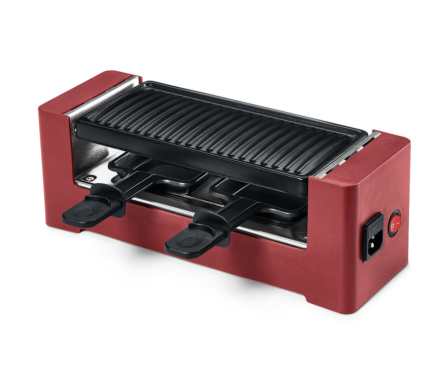 Czerwony grill do raclette dla 2 osób z powłoką zapobiegającą przywieraniu i dwoma patelniami.