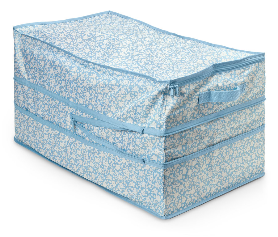 Duża torba do przechowywania w niebiesko-biały kwiatowy wzór, zapinana na zamek błyskawiczny.