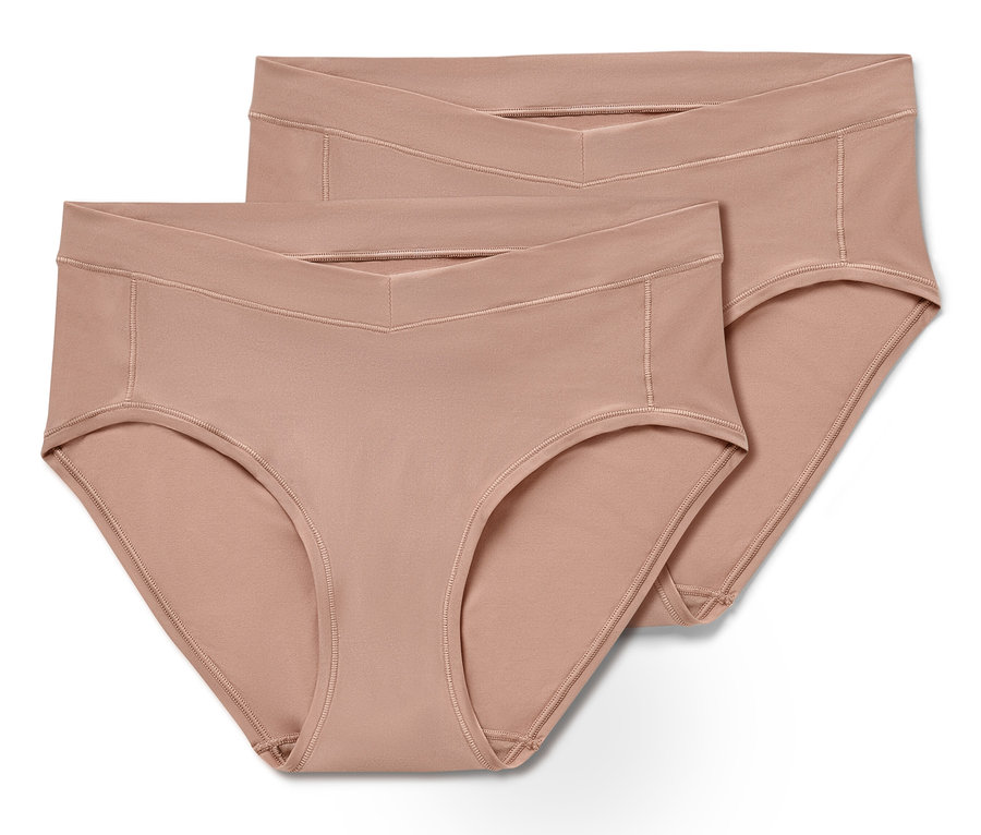 Dwie pary beżowych fig typu hipster w rozmiarze uniwersalnym leżą na sobie.