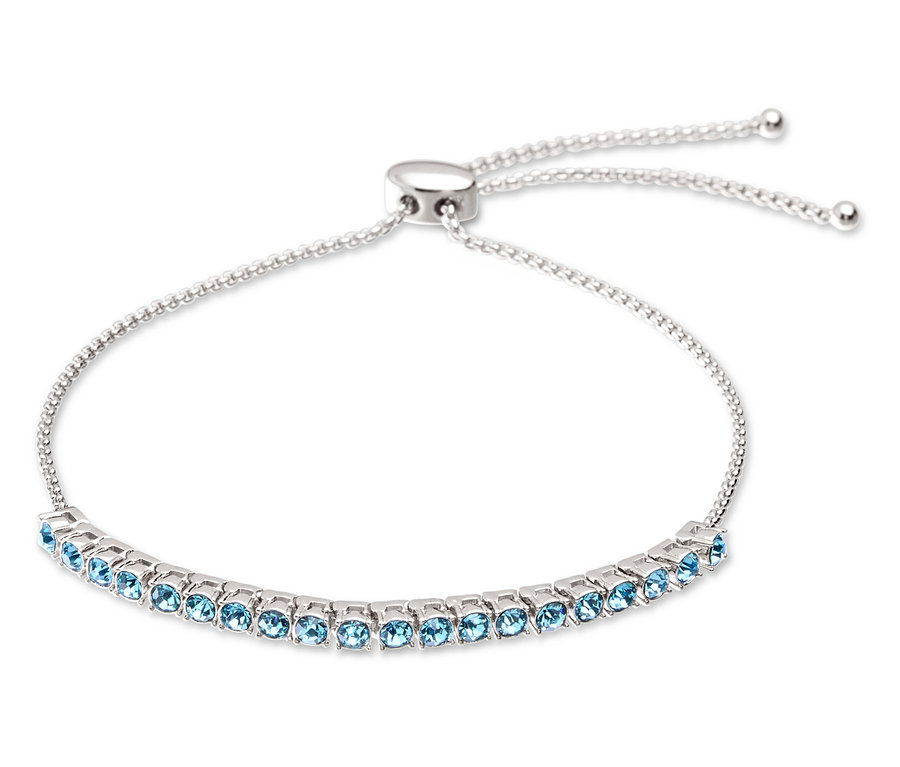 Srebrna bransoletka z jasnoniebieskimi kamieniami i regulowanym zapięciem.
