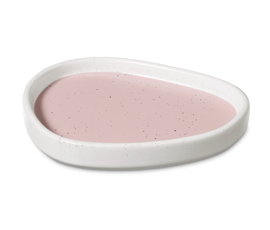 Taca z ceramiki z różowym płynem pośrodku.