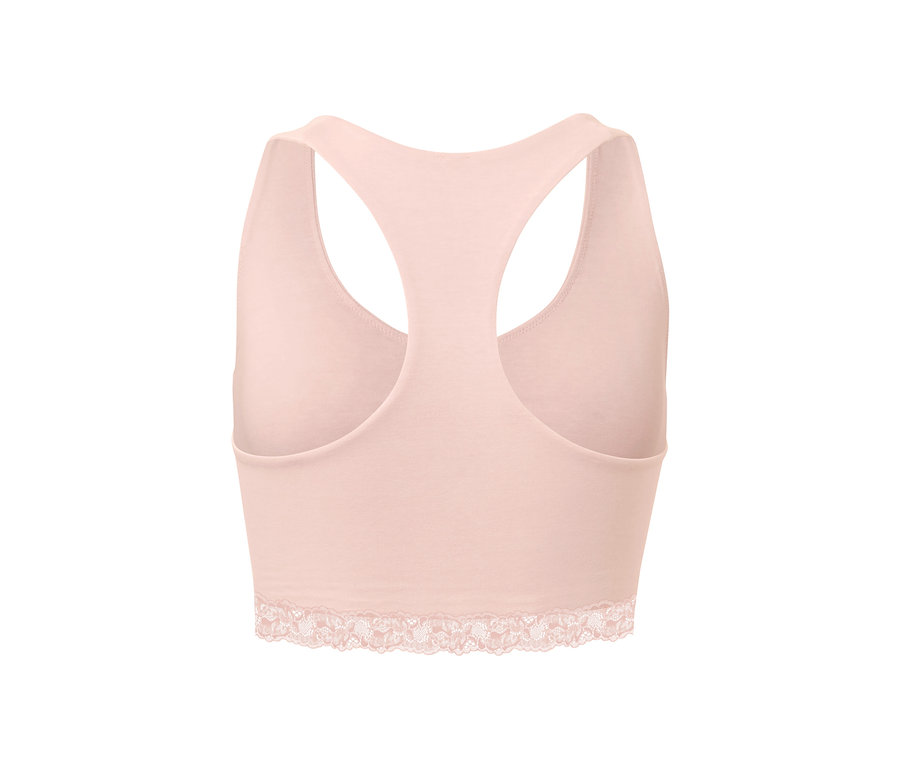 Różowy biustonosz typu bustier z koronką na dole i racerbackiem.