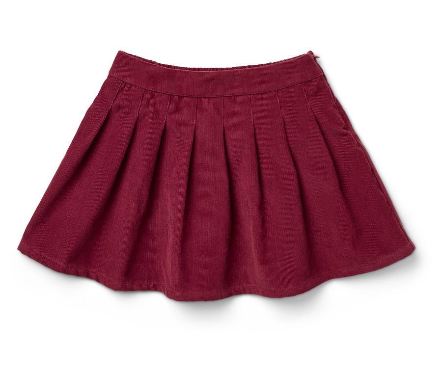 Burgundowa plisowana spódnica z aksamitu sztruksowego leży na białym tle.