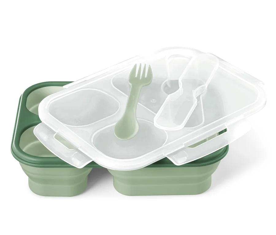 Zielony lunchbox składany z przezroczystą pokrywką i zielonym widelcem.