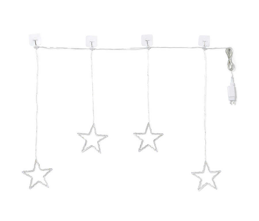 Cztery gwiazdy oświetlone diodami LED wiszą na kurtynie świetlnej LED.