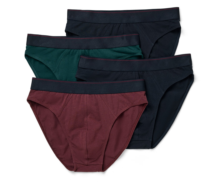 Pięć par męskich slipów w kolorach granatowym, zielonym i bordowym leży na sobie.