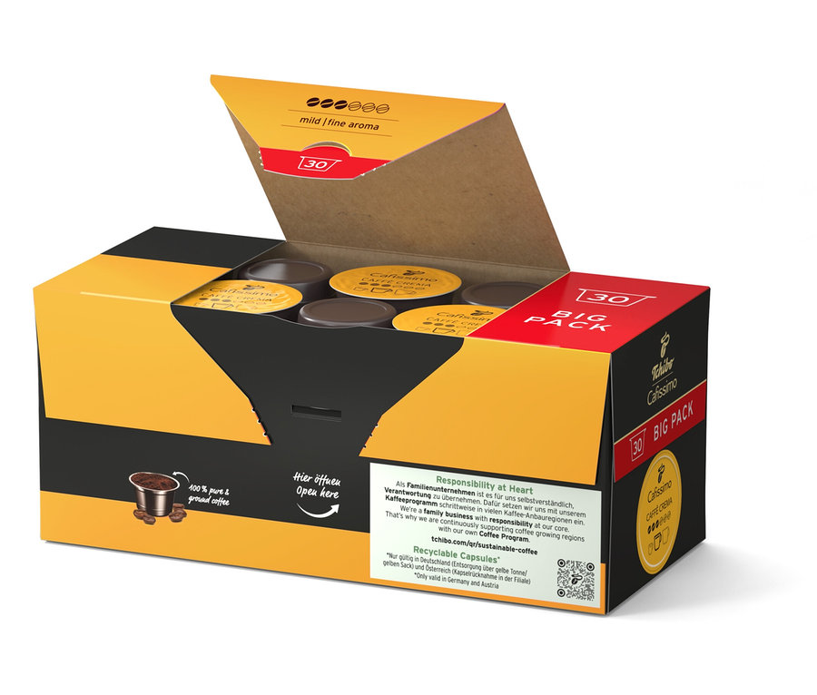 Otwarty żółto-czarny karton z kapsułkami do kawy.