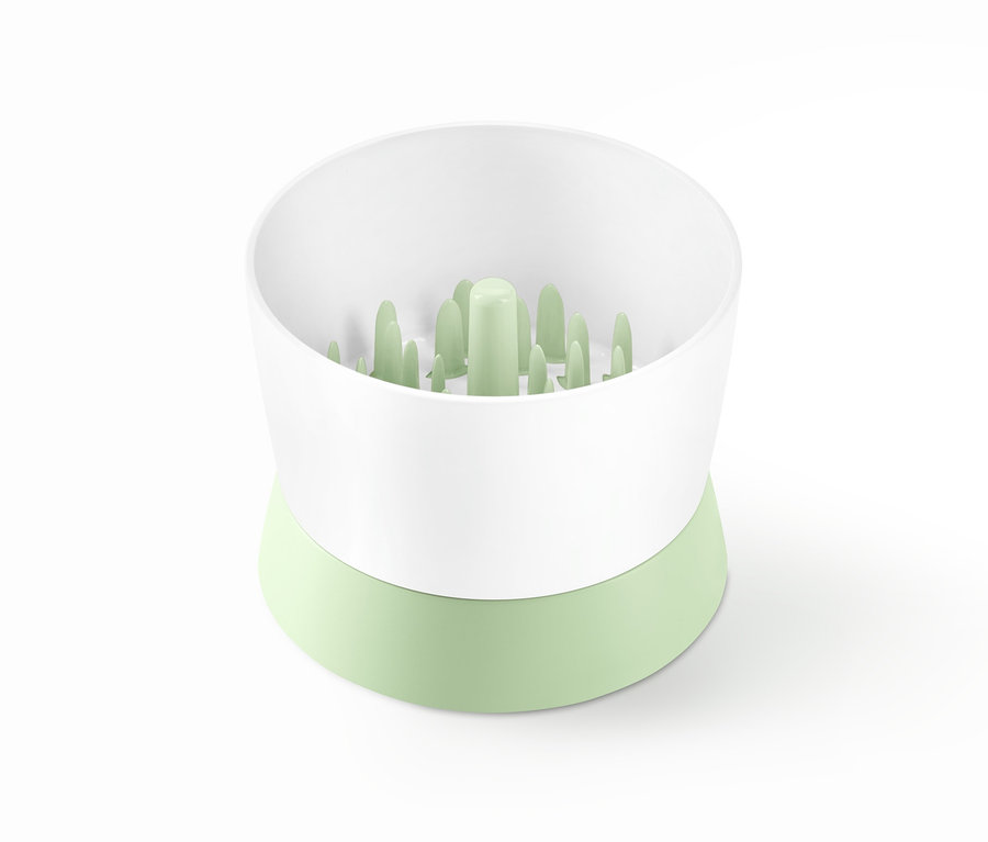 Rozdrabniacz do warzyw z białą górą i zieloną podstawą.