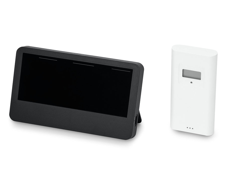 Czarny tablet obok białego czujnika.