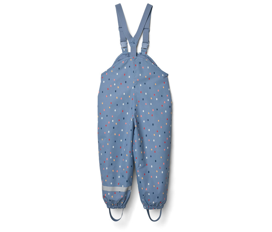 Niebieskie spodnie przeciwdeszczowe na szelkach w kolorowe kropki i paski odblaskowe.