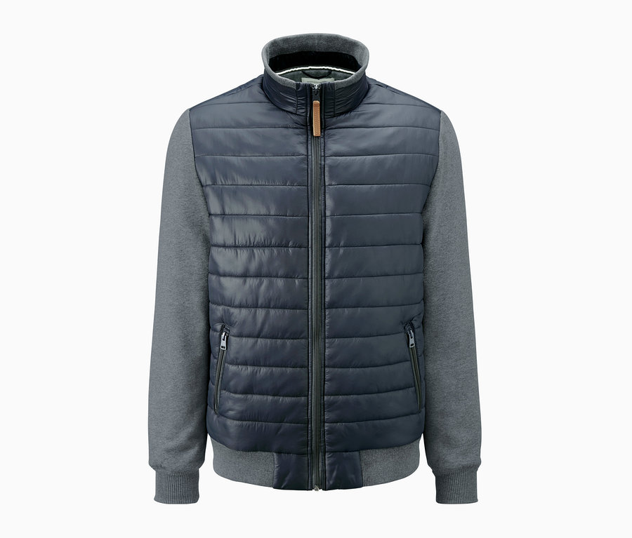 Pikowana kurtka dresowa w kolorze szaro-niebieskim, zapinana na zamek błyskawiczny.