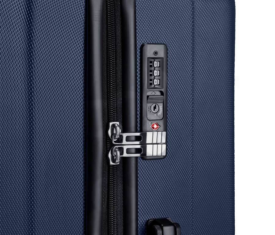 Zbliżenie na dużą walizkę z kompletu twardych walizek.