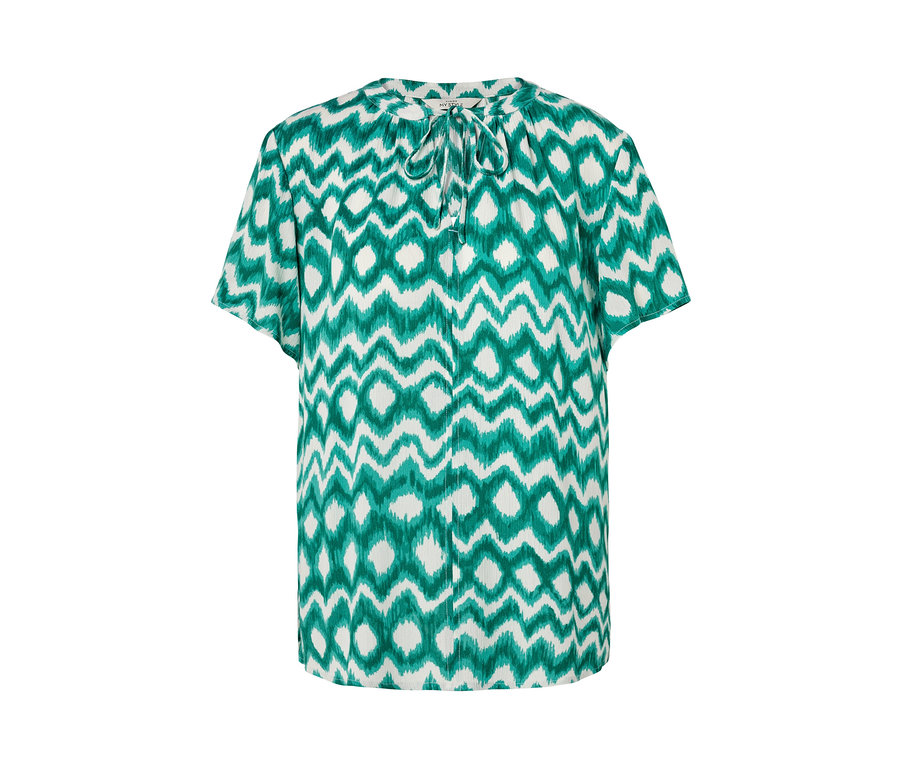 Biała tunika z zielonym wzorem.