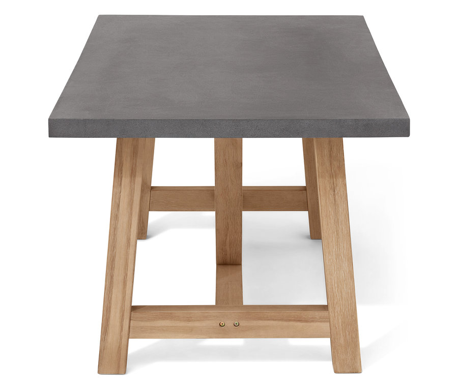 Szczegół szarego stołu z drewnianymi nogami.