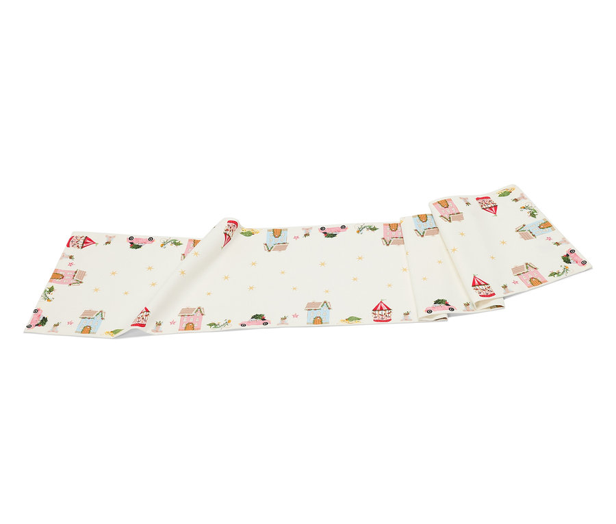 Biały pas materiału z rysunkami domów, samochodów i gwiazd.