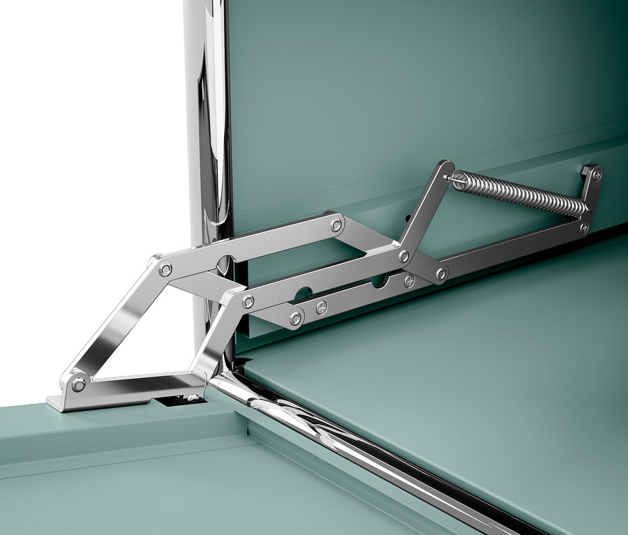 Szczegół mechanizmu otwierania zielonego pudełka.