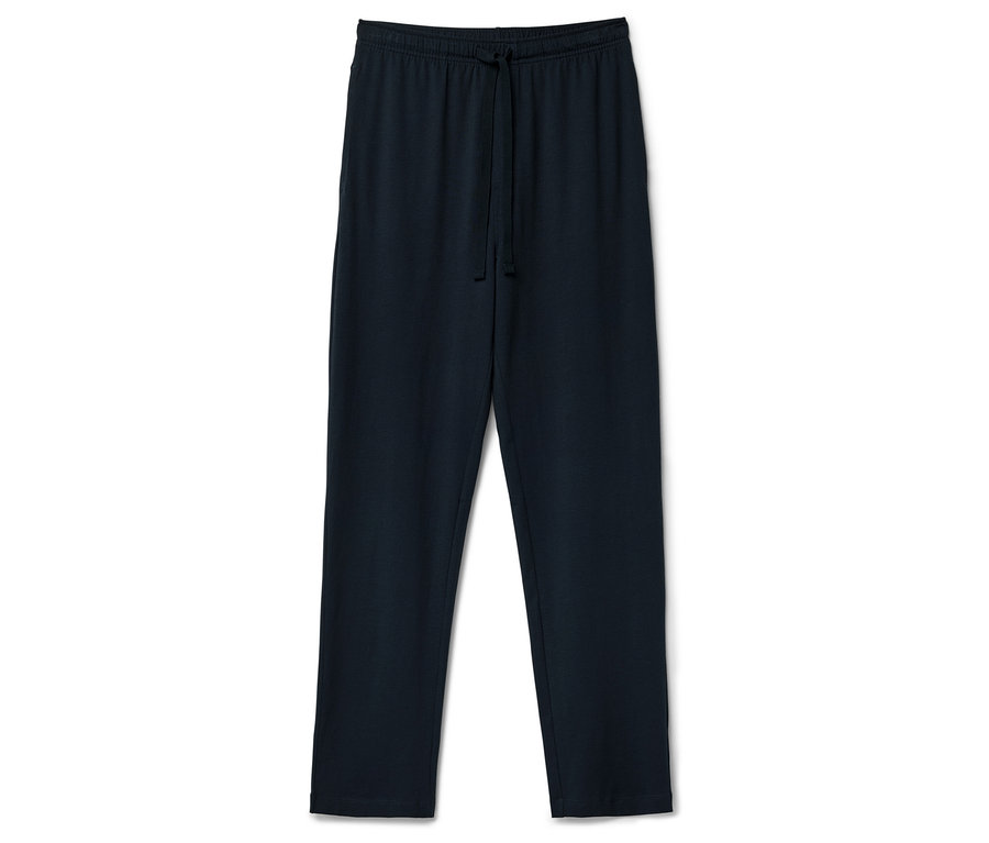 Granatowe spodnie dresowe ze sznurkiem leżą na białym tle.