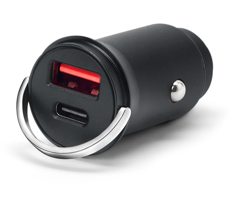 Czarna ładowarka USB z dwoma portami i srebrnym pierścieniem na białym tle.