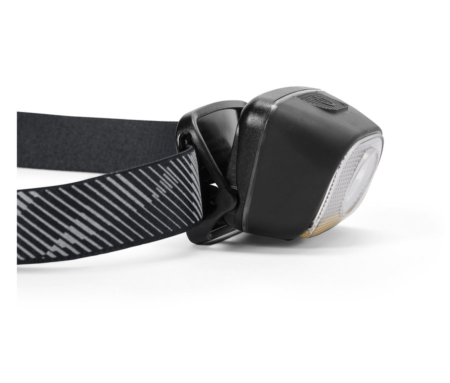 Szczegółowe ujęcie czarnej latarki czołowej z paskiem w paski.