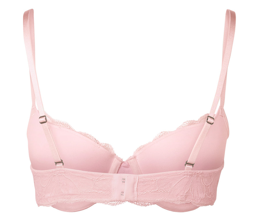 Szczegół różowego koronkowego biustonosza z regulowanymi ramiączkami.