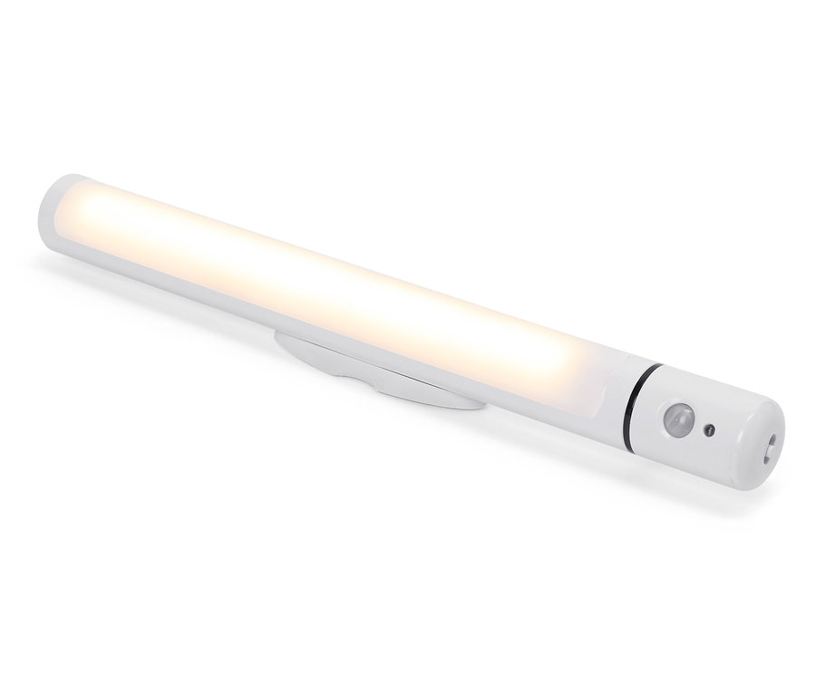 Białe światło LED z czujnikiem ruchu leży na białym tle.