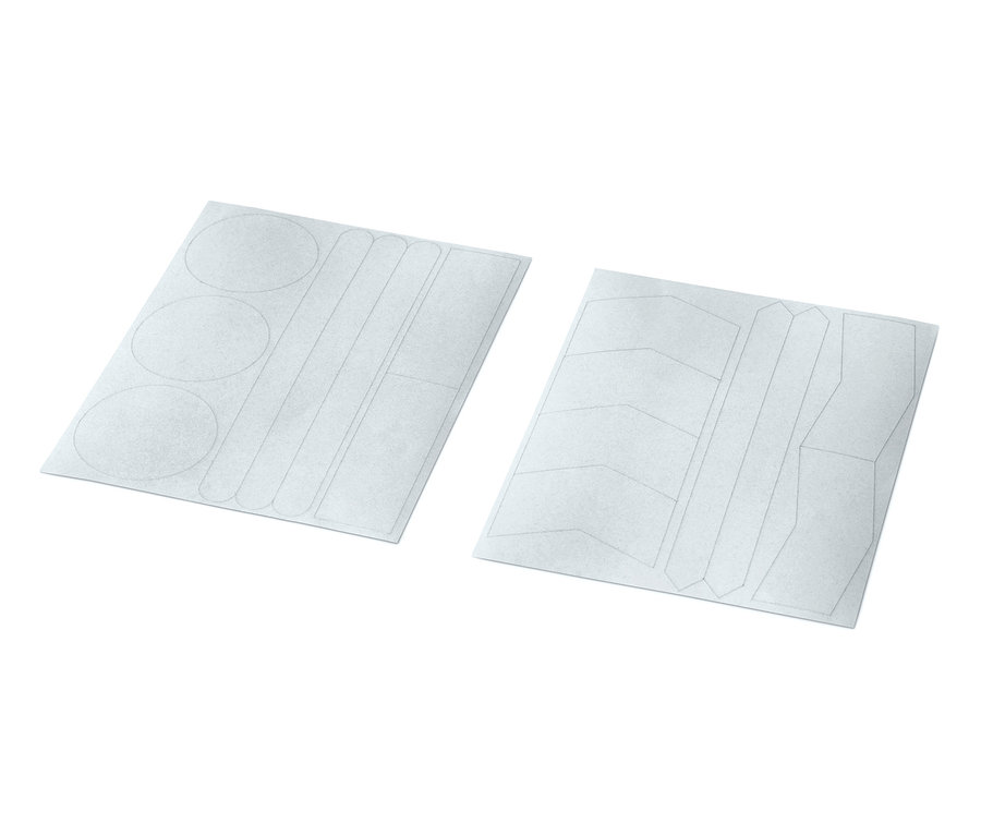 Dwa arkusze naklejek odblaskowych, łącznie 16 sztuk, o różnych kształtach.