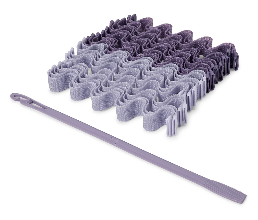 Zestaw fioletowych wałków do włosów i aplikator.