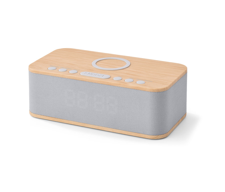 Zbliżenie na budzik z funkcją bezprzewodowego ładowania i Bluetooth®. Górna część jest drewniana, reszta jest szara.