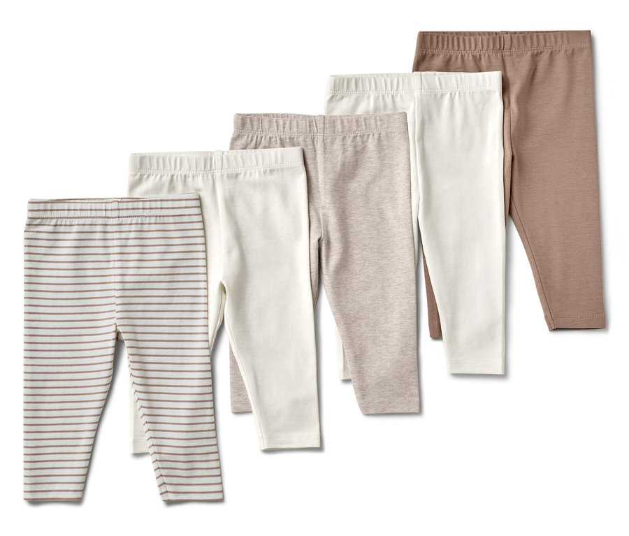 Pięć par dziecięcych legginsów w różnych kolorach i wzorach.