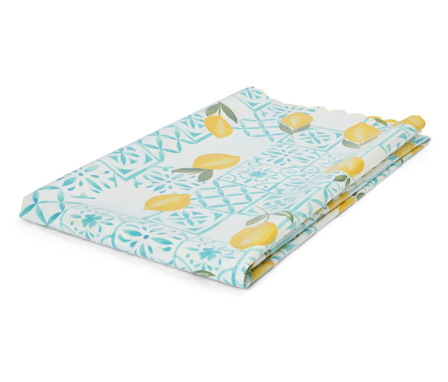 Złożona ściereczka z wzorem cytryn i turkusowymi ornamentami leży na białym tle.