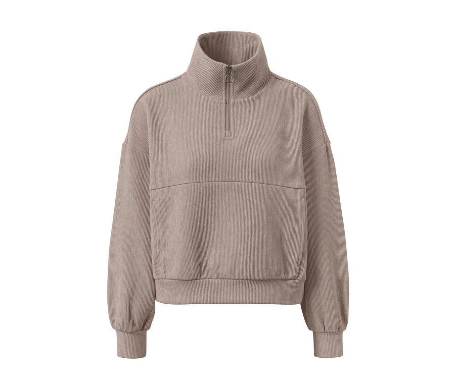 Beżowa bluza dresowa z krótkim zamkiem błyskawicznym i prążkowaną teksturą.