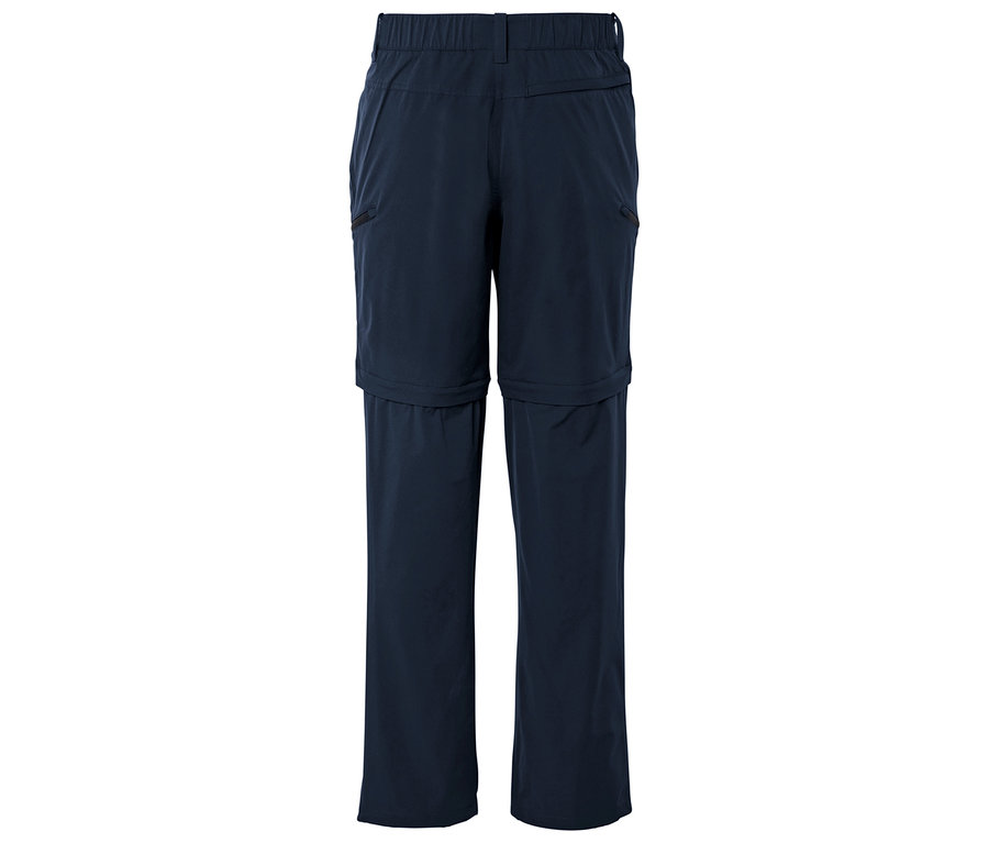 Ciemnoniebieskie, długie spodnie z zamkiem błyskawicznym pod kolanem, sfotografowane od tyłu.