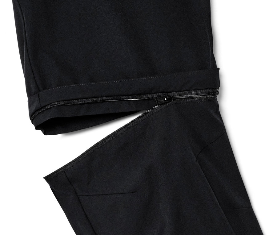 Szczegół czarnych spodni funkcyjnych 2 w 1 z zamkiem błyskawicznym.