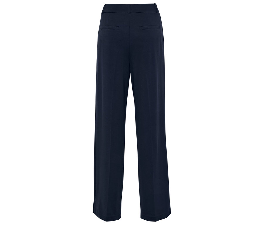 Widok z tyłu na granatowe spodnie z szerokimi nogawkami.