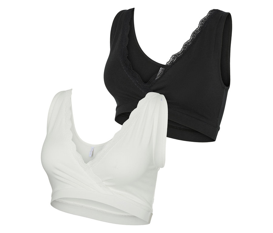 Dwa biustonosze ciążowe MAMALICIOUS „MLHELENA” w zestawie po 2 sztuki, jeden biały i jeden czarny, oba z koronkowym wykończeniem.