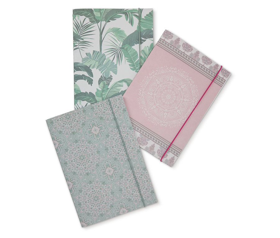 Trzy notesy z różnymi wzorami.