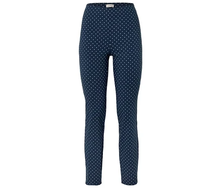 Niebieskie legginsy w białe kropki.