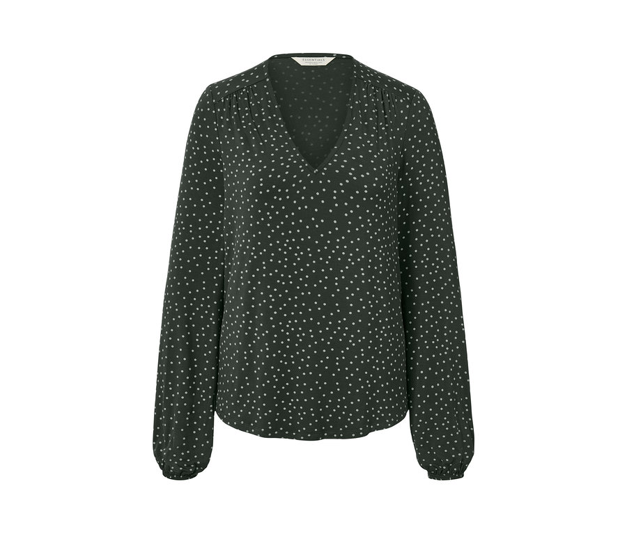 Na zdjęciu bluzka w kropki.