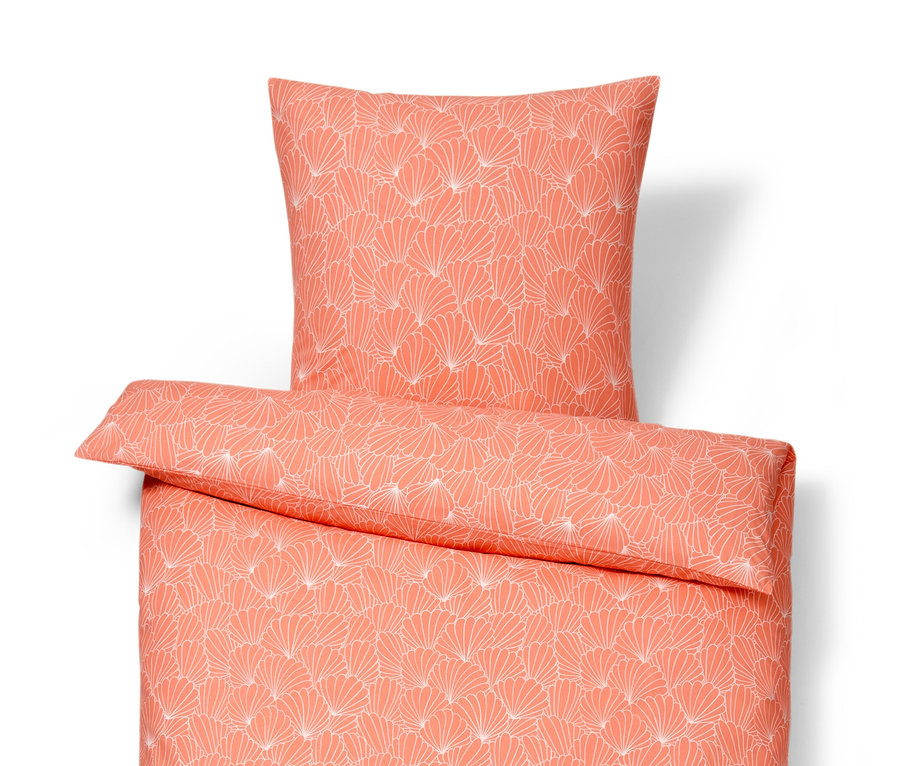 Pomarańczowa pościel z bawełny renforcé w standardowym rozmiarze z białym kwiatowym wzorem, w zestawie z poduszką.