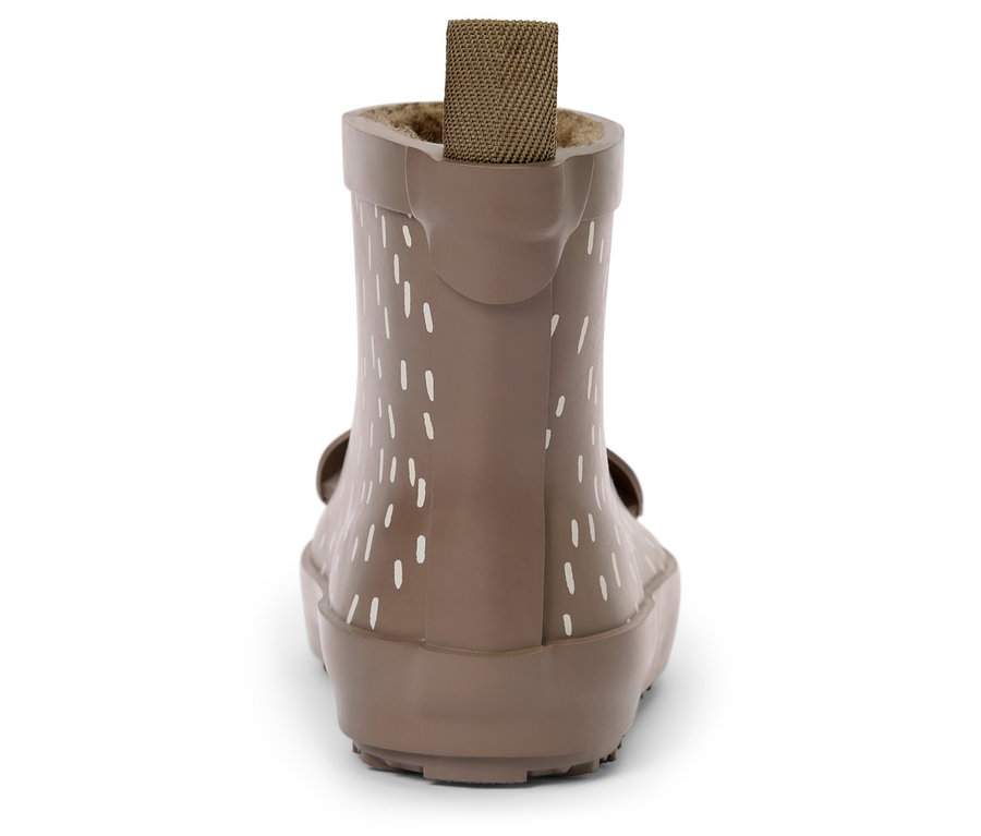 Beżowy kalosz z białymi pionowymi paskami i brązową materiałową pętelką z tyłu.