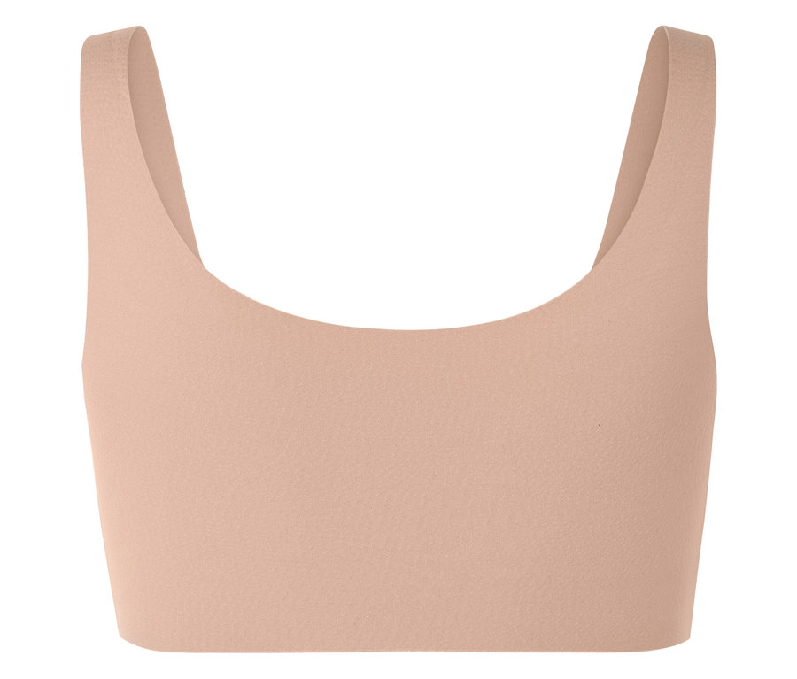 Brzoskwiniowy top sportowy z szerokimi ramiączkami.