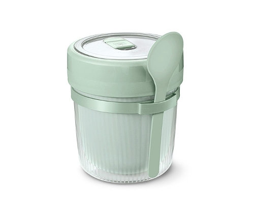 Zielony pojemnik na zupę z łyżką.