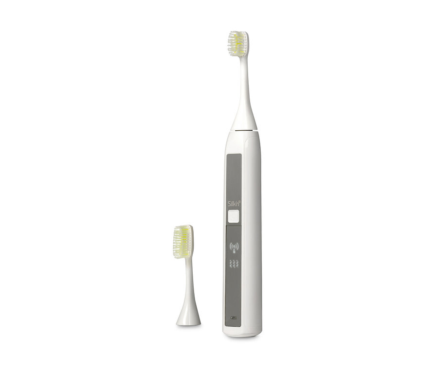 Elektryczna szczoteczka do zębów Silk'n® »ToothWave©« i główka szczoteczki.