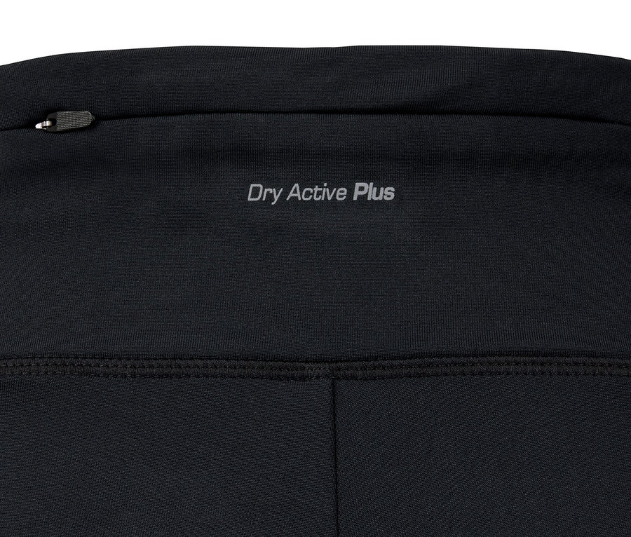 Zbliżenie na ciepłe spodnie z napisem Dry Active Plus i kieszenią na zamek.