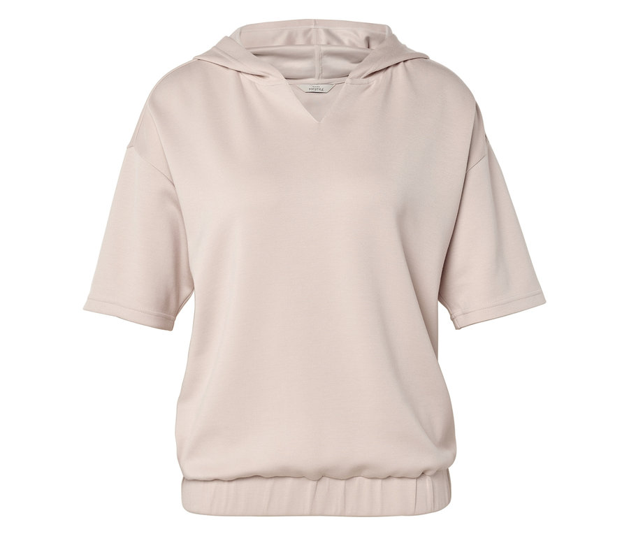 Na zdjęciu beżowa bluza z kapturem i krótkimi rękawami.
