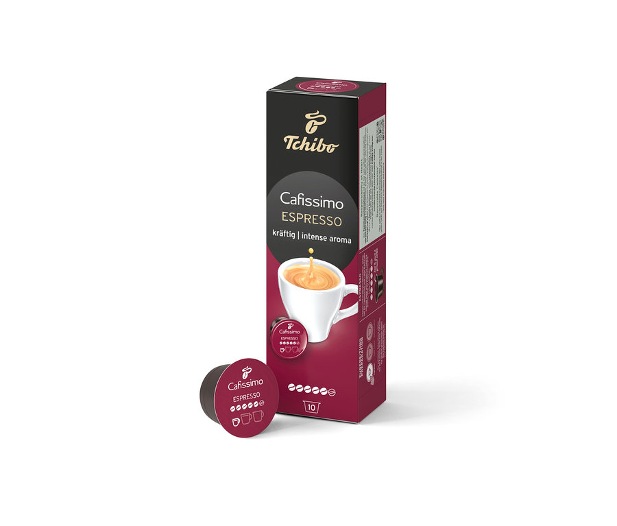 Pudełko Cafissimo Espresso kräftig z 10 kapsułkami stoi obok pojedynczej kapsułki.