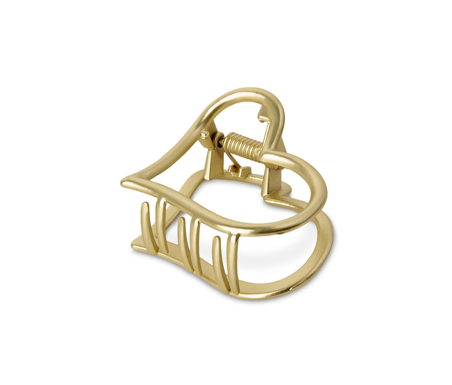 Złota spinka do włosów w kształcie serca.